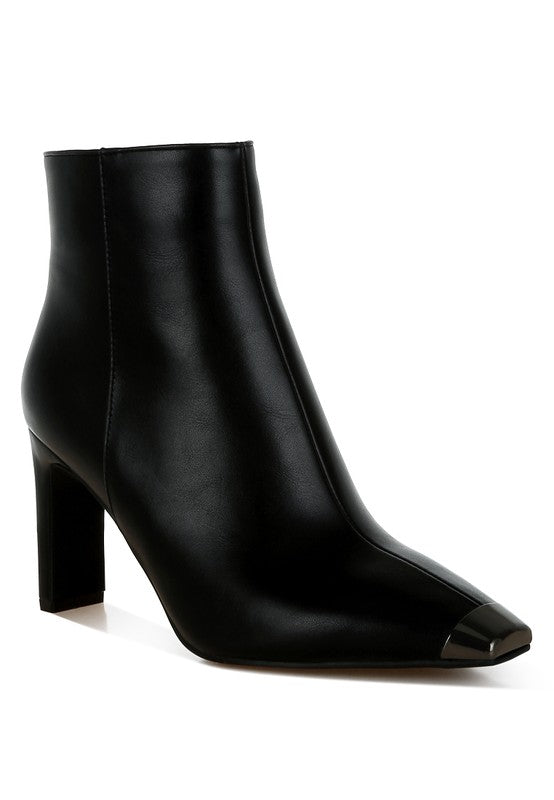 Orca metallic cap toe faux leather boots with slim block heels and zipper closure.