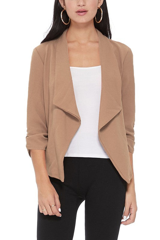 Casual solid waist length blazer jacket with ruched 3/4 sleeves.