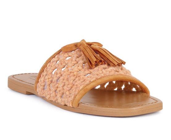 Cedar handwoven natural tassel flats with suede frame and open toe design.