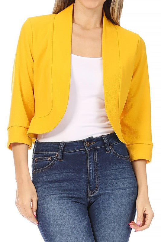 Solid waist length collarless blazer cardigan with open front and 3/4 cuffed sleeves.