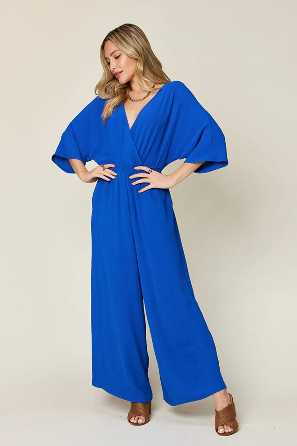 Double Take Full Size Surplice wide leg jumpsuit with pockets and ruched tie detail