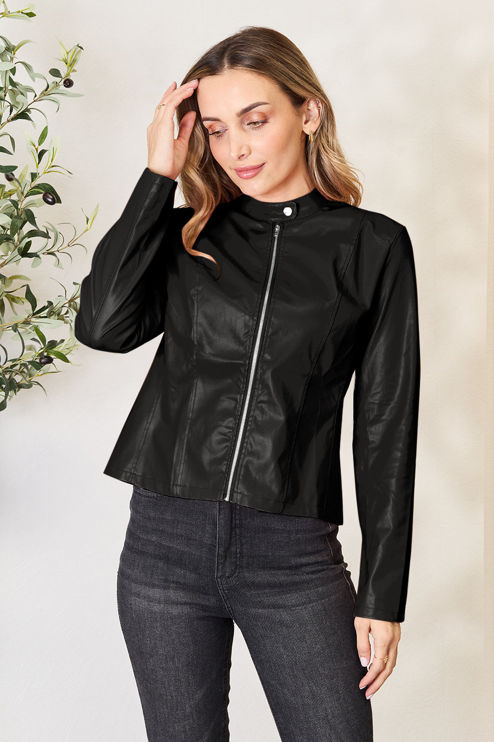 Mock neck zip up jacket in black, featuring a buttoned design, made of 95% polyester and 5% spandex.